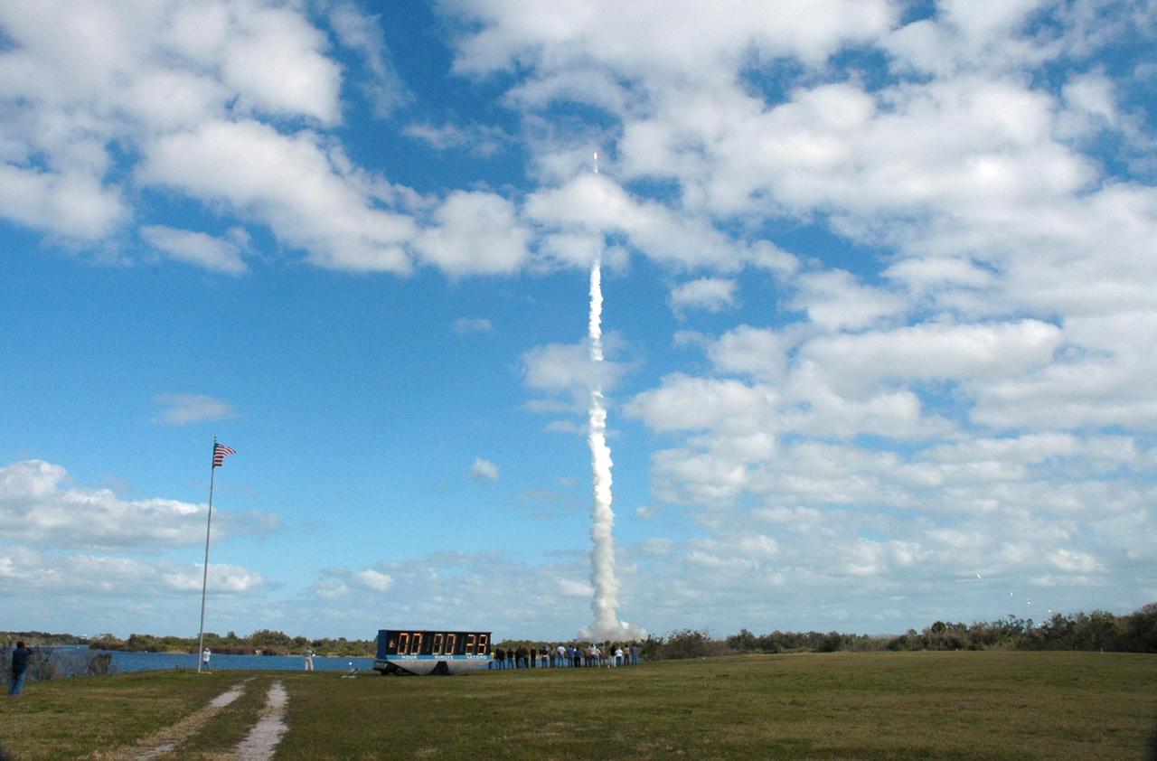 KENNEDY SPACE CENTER, FLA. — Viewed from the NASA News Center, NASA’s New Horizons spacecraft roars into the cloud-scattered sky trailing fire and smoke from the Atlas V rocket that propels it. Liftoff was on time at 2 p.m. EST from Complex 41 on Cape Canaveral Air Force Station in Florida. This was the third launch attempt in as many days after scrubs due to weather concerns. The compact, 1,050-pound piano-sized probe will get a boost from a kick-stage solid propellant motor for its journey to Pluto. New Horizons will be the fastest spacecraft ever launched, reaching lunar orbit distance in just nine hours and passing Jupiter 13 months later. The New Horizons science payload, developed under direction of Southwest Research Institute, includes imaging infrared and ultraviolet spectrometers, a multi-color camera, a long-range telescopic camera, two particle spectrometers, a space-dust detector and a radio science experiment. The dust counter was designed and built by students at the University of Colorado, Boulder. The launch at this time allows New Horizons to fly past Jupiter in early 2007 and use the planet’s gravity as a slingshot toward Pluto. The Jupiter flyby trims the trip to Pluto by as many as five years and provides opportunities to test the spacecraft’s instruments and flyby capabilities on the Jupiter system. New Horizons could reach the Pluto system as early as mid-2015, conducting a five-month-long study possible only from the close-up vantage of a spacecraft. Photo credit: NASA/Fletch Hildreth