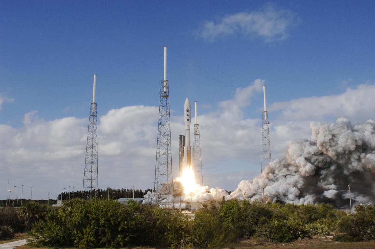 KENNEDY SPACE CENTER, FLA. — Into a cloud-scattered blue sky, NASA’s New Horizons spacecraft roars off the launch pad aboard an Atlas V rocket spewing flames and smoke. Liftoff was on time at 2 p.m. EST from Complex 41 on Cape Canaveral Air Force Station in Florida. This was the third launch attempt in as many days after scrubs due to weather concerns. The compact, 1,050-pound piano-sized probe will get a boost from a kick-stage solid propellant motor for its journey to Pluto. New Horizons will be the fastest spacecraft ever launched, reaching lunar orbit distance in just nine hours and passing Jupiter 13 months later. The New Horizons science payload, developed under direction of Southwest Research Institute, includes imaging infrared and ultraviolet spectrometers, a multi-color camera, a long-range telescopic camera, two particle spectrometers, a space-dust detector and a radio science experiment. The dust counter was designed and built by students at the University of Colorado, Boulder. The launch at this time allows New Horizons to fly past Jupiter in early 2007 and use the planet’s gravity as a slingshot toward Pluto. The Jupiter flyby trims the trip to Pluto by as many as five years and provides opportunities to test the spacecraft’s instruments and flyby capabilities on the Jupiter system. New Horizons could reach the Pluto system as early as mid-2015, conducting a five-month-long study possible only from the close-up vantage of a spacecraft.