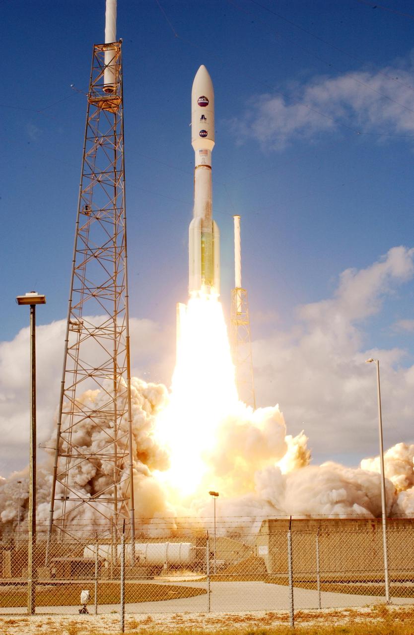 KENNEDY SPACE CENTER, FLA.  —   From between lightning masts surrounding the launch pad, NASA’s New Horizons spacecraft roars into the blue sky aboard an Atlas V rocket spewing flames and smoke.  Liftoff was on time at 2 p.m. EST from Complex 41 on Cape Canaveral Air Force Station in Florida.  This was the third launch attempt in as many days after scrubs due to weather concerns.   The compact, 1,050-pound piano-sized probe will get a boost from a kick-stage solid propellant motor for its journey to Pluto. New Horizons will be the fastest spacecraft ever launched, reaching lunar orbit distance in just nine hours and passing Jupiter 13 months later. The New Horizons science payload, developed under direction of Southwest Research Institute, includes imaging infrared and ultraviolet spectrometers, a multi-color camera, a long-range telescopic camera, two particle spectrometers, a space-dust detector and a radio science experiment. The dust counter was designed and built by students at the University of Colorado, Boulder. The launch at this time allows New Horizons to fly past Jupiter in early 2007 and use the planet’s gravity as a slingshot toward Pluto. The Jupiter flyby trims the trip to Pluto by as many as five years and provides opportunities to test the spacecraft’s instruments and flyby capabilities on the Jupiter system. New Horizons could reach the Pluto system as early as mid-2015, conducting a five-month-long study possible only from the close-up vantage of a spacecraft.