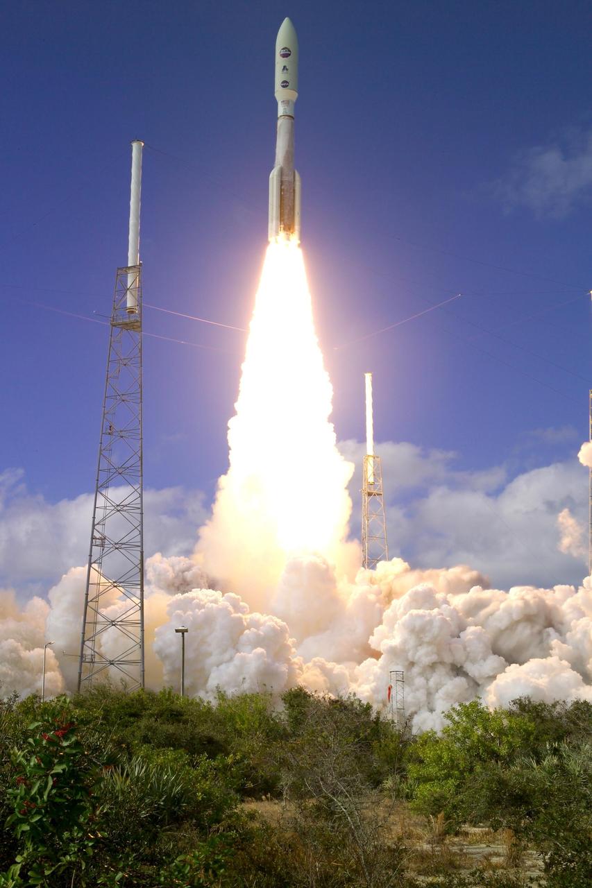 KENNEDY SPACE CENTER, FLA.  —   From between lightning masts surrounding the launch pad, NASA’s New Horizons spacecraft roars into the blue sky aboard an Atlas V rocket spewing flames and smoke.  Liftoff was on time at 2 p.m. EST from Complex 41 on Cape Canaveral Air Force Station in Florida.  This was the third launch attempt in as many days after scrubs due to weather concerns.   The compact, 1,050-pound piano-sized probe will get a boost from a kick-stage solid propellant motor for its journey to Pluto. New Horizons will be the fastest spacecraft ever launched, reaching lunar orbit distance in just nine hours and passing Jupiter 13 months later. The New Horizons science payload, developed under direction of Southwest Research Institute, includes imaging infrared and ultraviolet spectrometers, a multi-color camera, a long-range telescopic camera, two particle spectrometers, a space-dust detector and a radio science experiment. The dust counter was designed and built by students at the University of Colorado, Boulder. The launch at this time allows New Horizons to fly past Jupiter in early 2007 and use the planet’s gravity as a slingshot toward Pluto. The Jupiter flyby trims the trip to Pluto by as many as five years and provides opportunities to test the spacecraft’s instruments and flyby capabilities on the Jupiter system. New Horizons could reach the Pluto system as early as mid-2015, conducting a five-month-long study possible only from the close-up vantage of a spacecraft.