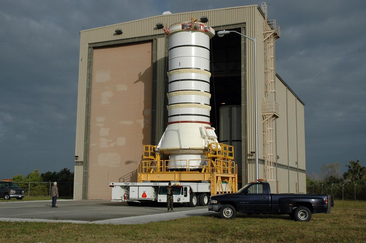 KENNEDY SPACE CENTER, FLA.  —   The right aft booster, comprised of the aft skirt and the aft motor segment, rolls out of the Rotation Processing and Surge Facility for transfer to the Vehicle Assembly Building where it will be lifted onto the mobile launcher platform. The booster is being assembled for the space shuttle Discovery on mission STS-121, the second space shuttle mission in the return-to-flight sequence. The booster assembly is a major milestone in the processing sequence that leads to launch.  The launch date is targeted no earlier than May.  Photo credit:  NASA/Jack Pfaller