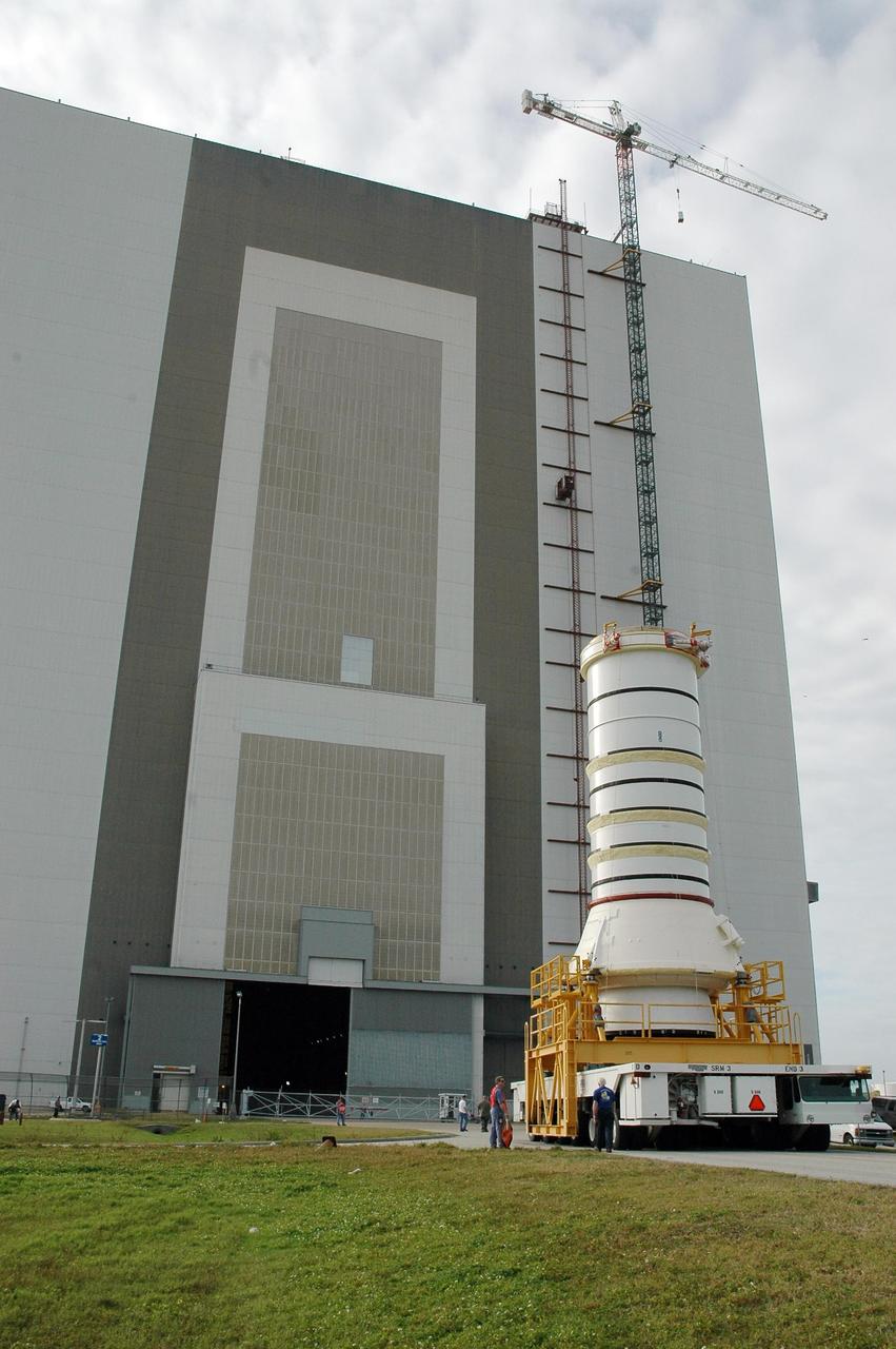 KENNEDY SPACE CENTER, FLA.  —   The right aft booster, comprised of the aft skirt and the aft motor segment, rolls toward the Vehicle Assembly Building where it will be lifted onto the mobile launcher platform.  The booster is being assembled for the space shuttle Discovery on mission STS-121, the second space shuttle mission in the return-to-flight sequence. The booster assembly is a major milestone in the processing sequence that leads to launch.  The launch date is targeted no earlier than May.  Photo credit:  NASA/Jack Pfaller