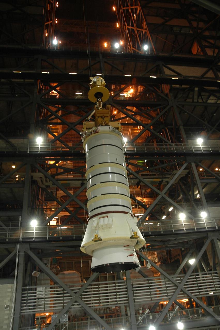 KENNEDY SPACE CENTER, FLA.  —  In the Vehicle Assembly Building at NASA Kennedy Space Center, the right aft booster segments (aft skirt and aft motor segment) near the point where they will be moved over into the high bay and lowered onto the mobile launcher platform in Bay 3. The segments are being stacked for use with space shuttle Discovery on mission STS-121.  Mission STS-121 is the second space shuttle mission in the return-to-flight sequence.  The booster assembly is a major milestone in the processing sequence that leads to launch.  The launch date is targeted no earlier than May.  Photo credit:  NASA/Jack Pfaller