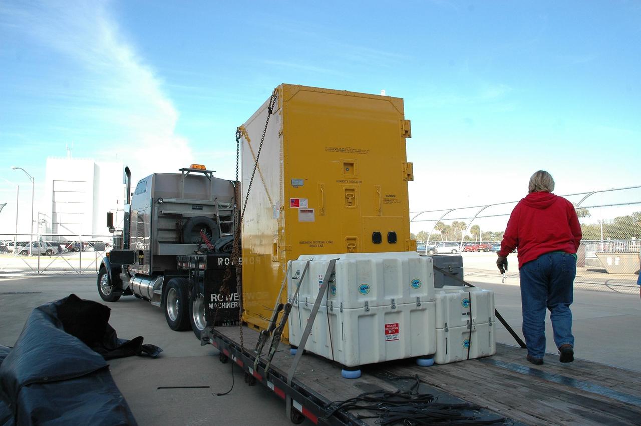 KENNEDY SPACE CENTER, FLA.  — A truck arrives at NASA Kennedy Space Center carrying a new environmental control and life support system.  The life support system is part of the payload on the second return-to-flight test mission, STS-121, aboard space shuttle Discovery to the International Space Station.  The system will add to the station’s oxygen-making capabilities and could provide enough oxygen for up to six people.  Managed by Marshall Space Flight Center in Huntsville, the system was built by Hamilton Sundstrand Corp. in Connecticut.  Discovery will carry more than two tons of equipment and supplies to the station.  This second return-to-flight test mission is to carry on analysis of safety improvements that debuted on the first return-to-flight mission, STS-114, and build upon those tests.  The launch is targeted for a date no earlier than May. Photo credit: NASA/Jack Pfaller