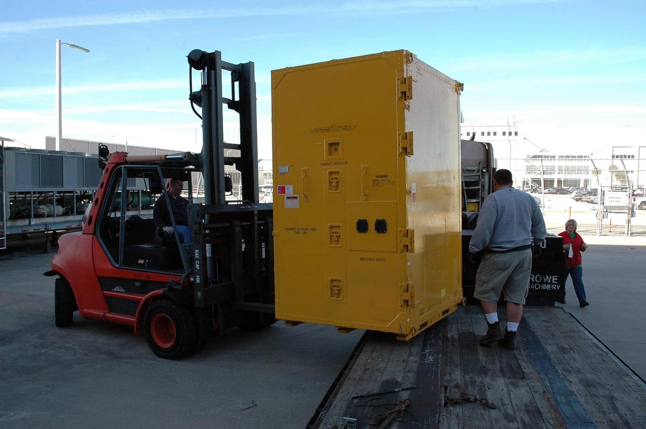 KENNEDY SPACE CENTER, FLA.  — At NASA Kennedy Space Center, a new environmental control and life support system is offloaded from a truck.  The life support system is part of the payload on the second return-to-flight test mission, STS-121, aboard space shuttle Discovery to the International Space Station.  The system will add to the station’s oxygen-making capabilities and could provide enough oxygen for up to six people.  Managed by Marshall Space Flight Center in Huntsville, the system was built by Hamilton Sundstrand Corp. in Connecticut.  Discovery will carry more than two tons of equipment and supplies to the station.  This second return-to-flight test mission is to carry on analysis of safety improvements that debuted on the first return-to-flight mission, STS-114, and build upon those tests.  The launch is targeted for a date no earlier than May. Photo credit: NASA/Jack Pfaller
