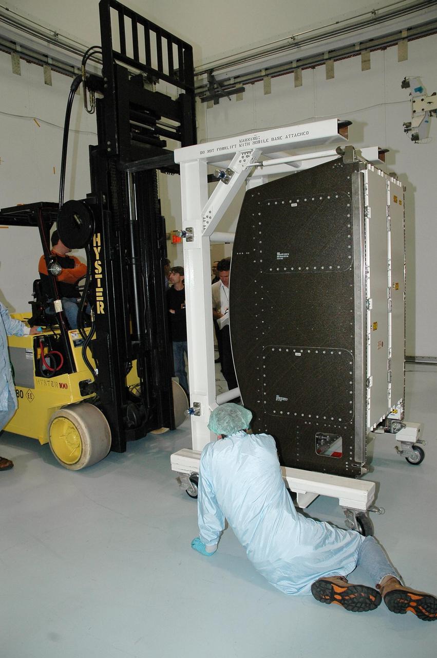 KENNEDY SPACE CENTER, FLA.  — At NASA Kennedy Space Center, a new environmental control and life support system is moved into the Space Station Processing Facility after being removed from its shipping container. The life support system is part of the payload on the second return-to-flight test mission, STS-121, aboard space shuttle Discovery to the International Space Station.  The system will add to the station’s oxygen-making capabilities and could provide enough oxygen for up to six people.  Managed by Marshall Space Flight Center in Huntsville, the system was built by Hamilton Sundstrand Corp. in Connecticut.  Discovery will carry more than two tons of equipment and supplies to the station.  This second return-to-flight test mission is to carry on analysis of safety improvements that debuted on the first return-to-flight mission, STS-114, and build upon those tests.  The launch is targeted for a date no earlier than May. Photo credit: NASA/Jack Pfaller