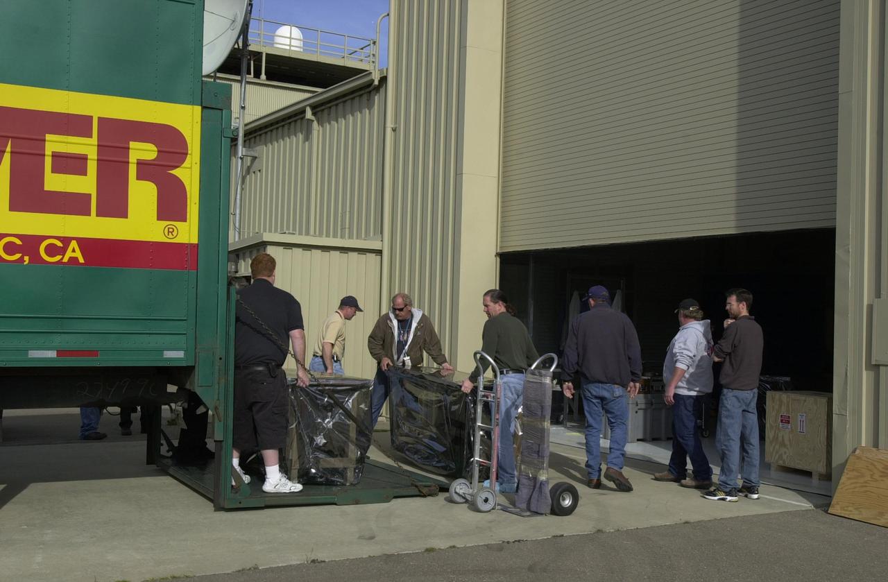 VANDENBERG AIR FORCE BASE, Calif.  —  At Vandenberg Air Force Base in California, workers are moving the Space Technology 5 (ST5) spacecraft out of the Orbital Sciences Building 836 onto a truck for transfer to Building 1555.  There it will be mated with the Pegasus XL launch vehicle.  ST5 will be launched by a Pegasus XL rocket. The satellites contain miniaturized redundant components and technologies.  Each will validate New Millennium Program selected technologies, such as the Cold Gas Micro-Thruster and X-Band Transponder Communication System.  After deployment from the Pegasus, the micro-satellites will be positioned in a “string of pearls” constellation that demonstrates the ability to position them to perform simultaneous multi-point measurements of the magnetic field using highly sensitive magnetometers.  The data will help scientists understand and map the intensity and direction of the Earth’s magnetic field, its relation to space weather events, and affects on our planet.  With such missions, NASA hopes to improve scientists’ ability to accurately forecast space weather and minimize its harmful effects on space- and ground-based systems.  Launch of ST5 is scheduled for Feb. 28 from Vandenberg Air Force Base.