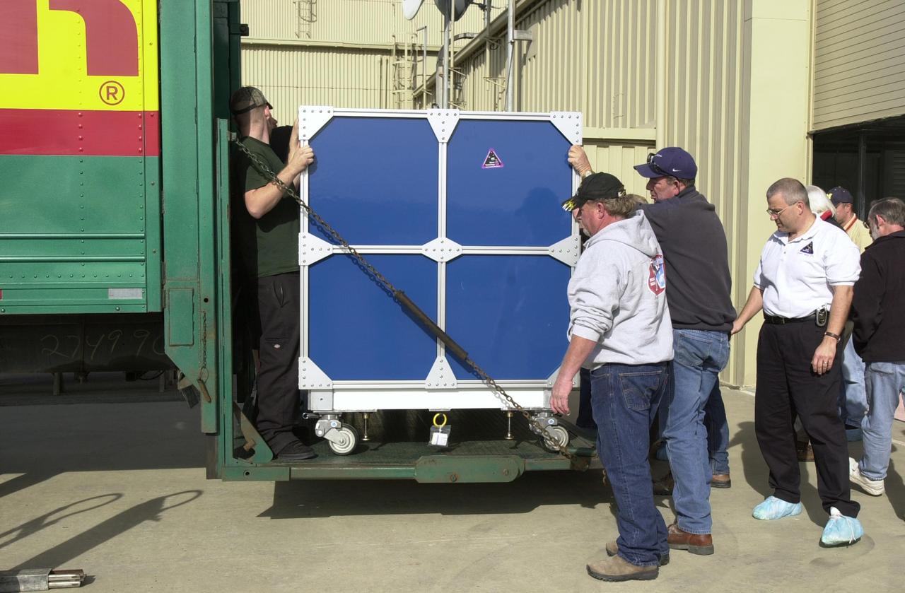 VANDENBERG AIR FORCE BASE, Calif.  —  At Vandenberg Air Force Base in California, workers are moving the Space Technology 5 (ST5) spacecraft out of the truck into Orbital Sciences’ Building 1555.  There it will be mated with the Pegasus XL launch vehicle.  ST5 will be launched by a Pegasus XL rocket. The satellites contain miniaturized redundant components and technologies.  Each will validate New Millennium Program selected technologies, such as the Cold Gas Micro-Thruster and X-Band Transponder Communication System.  After deployment from the Pegasus, the micro-satellites will be positioned in a “string of pearls” constellation that demonstrates the ability to position them to perform simultaneous multi-point measurements of the magnetic field using highly sensitive magnetometers.  The data will help scientists understand and map the intensity and direction of the Earth’s magnetic field, its relation to space weather events, and affects on our planet.  With such missions, NASA hopes to improve scientists’ ability to accurately forecast space weather and minimize its harmful effects on space- and ground-based systems.  Launch of ST5 is scheduled for Feb. 28 from Vandenberg Air Force Base.