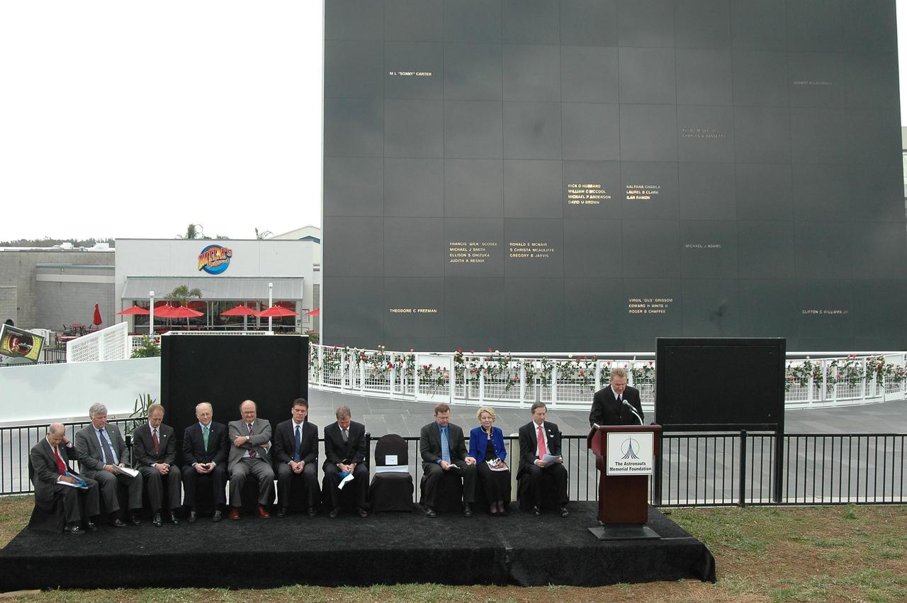 KENNEDY SPACE CENTER, FLA.  — Dr. Mick Ukleja gives the invocation at the opening of the Challenger memorial ceremony held Jan. 28 in front of the Space Memorial Mirror at NASA Kennedy Space Center’s Visitor Complex.  Others participating in the ceremony are Dr. Stephen Feldman, president of the Astronauts Memorial Foundation; Rep. Dave Weldon and Rep. Tom Feeney;  William Potter, chairman of the Board of Directors of the Astronauts Memorial Foundation; William Gerstenmaier, associate administrator for Space Operations at NASA; Jim Kennedy (second from left), center director of KSC; June Scobee Rodgers, widow of Dick Scobee, commander of Challenger; Col. Richard Scobee, son of Dick Scobee and June Scobee Rodgers; Capt. Frederick Hauck, commander of the first mission after Challenger; Dr. Joseph Allen, astronaut and scientist and chairman of the Board of the Challenger Centers for Space Science.   June Scobee Rodgers and Gerstenmaier placed a wreath at the base of the memorial.  Photo credit:  NASA/Kim Shiflett