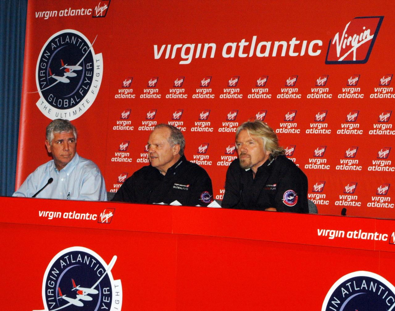 KENNEDY SPACE CENTER, FLA. - Media are gathered at NASA Kennedy Space Center’s television studio for a press conference with the principals in the Virgin Atlantic GlobalFlyer long-distance attempt.   Seated on the dais from left are Jim Ball, manager of KSC Spaceport Development; Steve Fossett, the pilot; and Sir Richard Branson, chairman and founder of Virgin Atlantic.  Steve Fossett will pilot the GlobalFlyer on a record-breaking attempt by flying solo, non-stop without refueling, to surpass the current record for the longest flight of any aircraft.  Fossett is expected to take off from the KSC Shuttle Landing Facility early Tuesday morning.   Photo credit: NASA/George Shelton