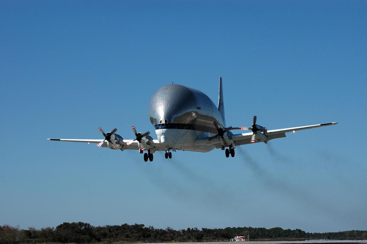 KENNEDY SPACE CENTER, FLA. - This Super Guppy aircraft approaches landing at NASA Kennedy Space Center’s Shuttle Landing Facility. It has flown to the Center to pick up and transport the common module structural test element to NASA's Marshall Space Flight Center in Huntsville, Ala. The common module is an aluminum canister used as a structural test element for an actual Space Station flight element. At Marshall, the module will be used to conduct advanced environmental control and life support testing for future NASA exploration missions. The Super Guppy aircraft has a unique hinged nose that can open more than 200 degrees, allowing large pieces of cargo to be loaded and unloaded from the front. Guppy aircraft were used in several past space programs, including Gemini, Apollo and Skylab, to transport spacecraft components. NASA personnel at Ellington Field outfitted the Super Guppy with a specially designed cradle to be used when carrying International Space Station components. The first Guppy aircraft was developed in 1962, designed specifically for NASA operations by Aero Spacelines of California. Photo credit: NASA/Kim Shiflett