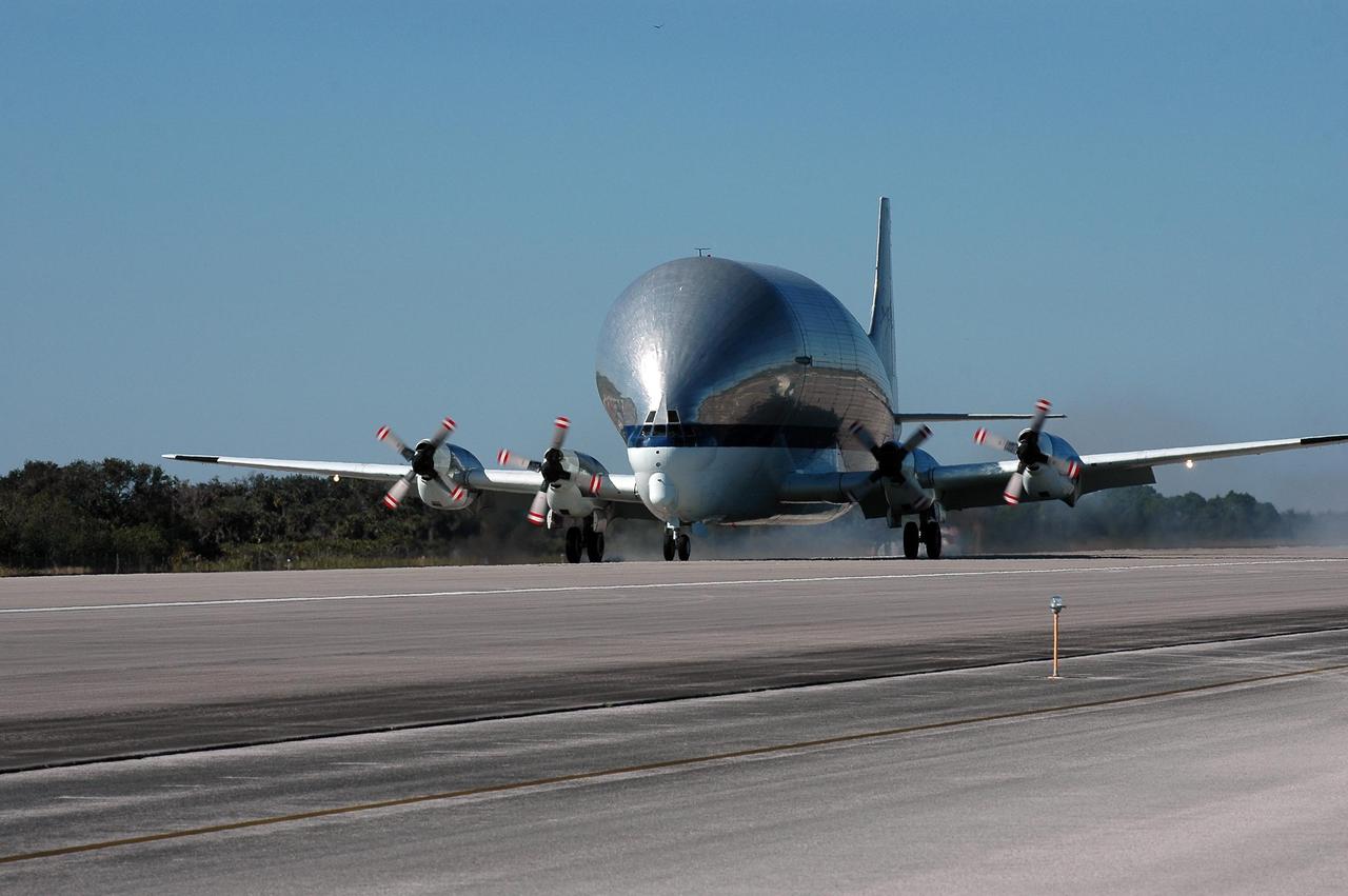 KENNEDY SPACE CENTER, FLA. - This Super Guppy aircraft rolls down the runway after landing at NASA Kennedy Space Center’s Shuttle Landing Facility. It has flown to the Center to pick up and transport the common module structural test element to NASA's Marshall Space Flight Center in Huntsville, Ala. The common module is an aluminum canister used as a structural test element for an actual Space Station flight element. At Marshall, the module will be used to conduct advanced environmental control and life support testing for future NASA exploration missions. The Super Guppy aircraft has a unique hinged nose that can open more than 200 degrees, allowing large pieces of cargo to be loaded and unloaded from the front. Guppy aircraft were used in several past space programs, including Gemini, Apollo and Skylab, to transport spacecraft components. NASA personnel at Ellington Field outfitted the Super Guppy with a specially designed cradle to be used when carrying International Space Station components. The first Guppy aircraft was developed in 1962, designed specifically for NASA operations by Aero Spacelines of California. Photo credit: NASA/Kim Shiflett