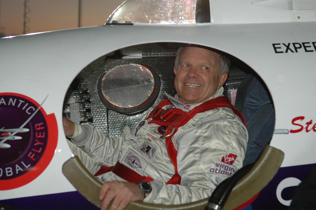 KENNEDY SPACE CENTER, FLA. -   At NASA Kennedy Space Center’s Shuttle Landing Facility, Steve Fossett is happy and eager to start what he hopes will be a historic flight in the Virgin Atlantic GlobalFlyer he is strapped into.  Fossett will pilot the GlobalFlyer on a record-breaking attempt by flying solo, non-stop without refueling, to surpass the current record for the longest flight of any aircraft. This is the second attempt in two days after a fuel leak was detected Feb. 7.  The expected time of takeoff is 7 a.m.  Photo credit: NASA/Kim Shiflett