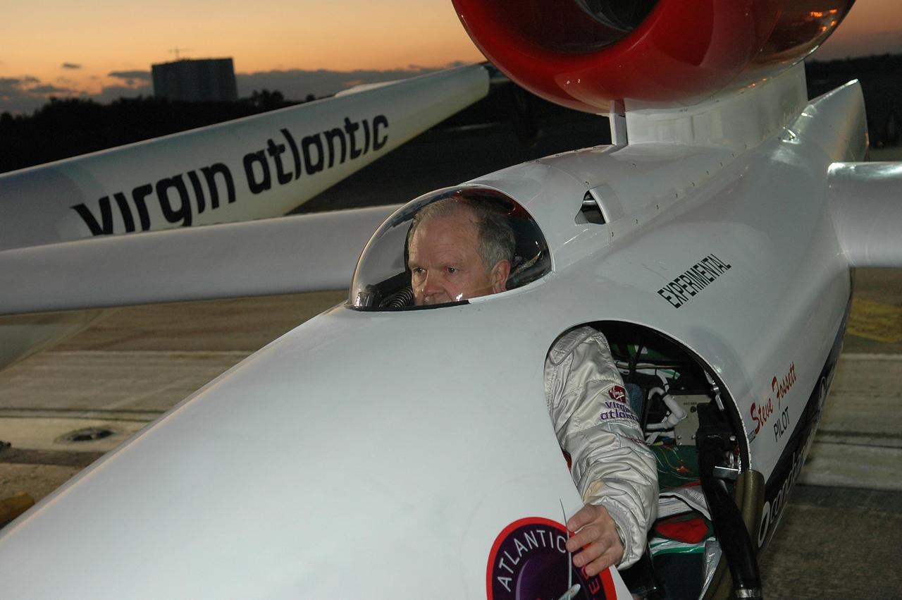 KENNEDY SPACE CENTER, FLA. -   At NASA Kennedy Space Center’s Shuttle Landing Facility, Steve Fossett, seated in the Virgin Atlantic GlobalFlyer cockpit, checks visibility and head space.    Fossett will pilot the GlobalFlyer on a record-breaking attempt by flying solo, non-stop without refueling, to surpass the current record for the longest flight of any aircraft. This is the second attempt in two days after a fuel leak was detected Feb. 7.  The expected time of takeoff is 7 a.m.  Photo credit: NASA/Kim Shiflett