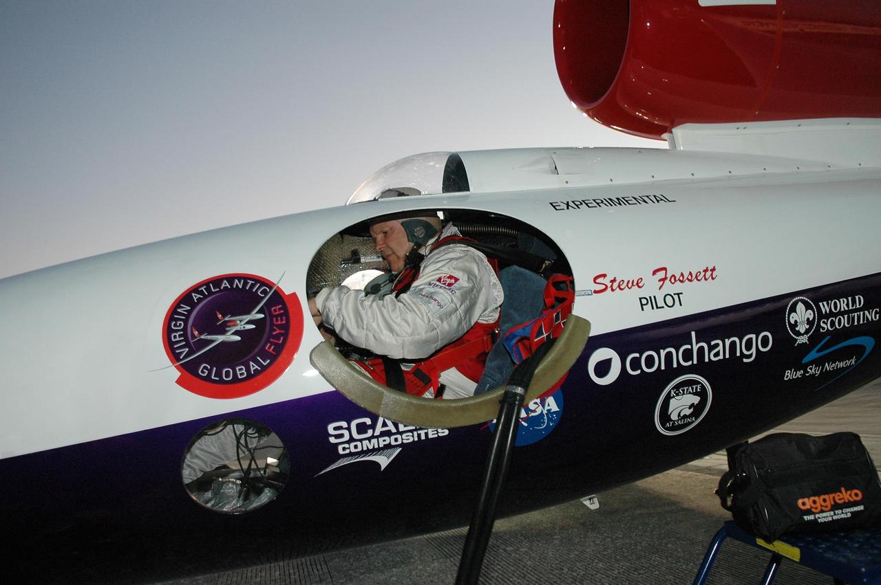 KENNEDY SPACE CENTER, FLA. -   At NASA Kennedy Space Center’s Shuttle Landing Facility, Steve Fossett, seated in the Virgin Atlantic GlobalFlyer cockpit, completes the checkout before takeoff.   Fossett will pilot the GlobalFlyer on a record-breaking attempt by flying solo, non-stop without refueling, to surpass the current record for the longest flight of any aircraft. This is the second attempt in two days after a fuel leak was detected Feb. 7.  The expected time of takeoff is 7 a.m.  Photo credit: NASA/Kim Shiflett