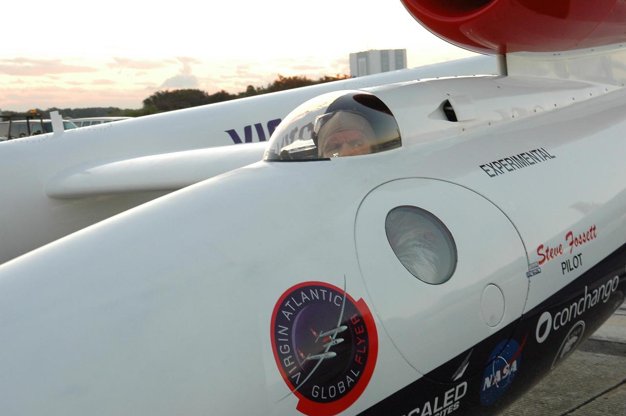 KENNEDY SPACE CENTER, FLA. -   At NASA Kennedy Space Center’s Shuttle Landing Facility, the door is closed on the Virgin Atlantic GlobalFlyer as pilot Steve Fossett looks out the cockpit window.   Fossett will pilot the GlobalFlyer on a record-breaking attempt by flying solo, non-stop without refueling, to surpass the current record for the longest flight of any aircraft. This is the second attempt in two days after a fuel leak was detected Feb. 7.  The expected time of takeoff is 7 a.m.  Photo credit: NASA/Kim Shiflett