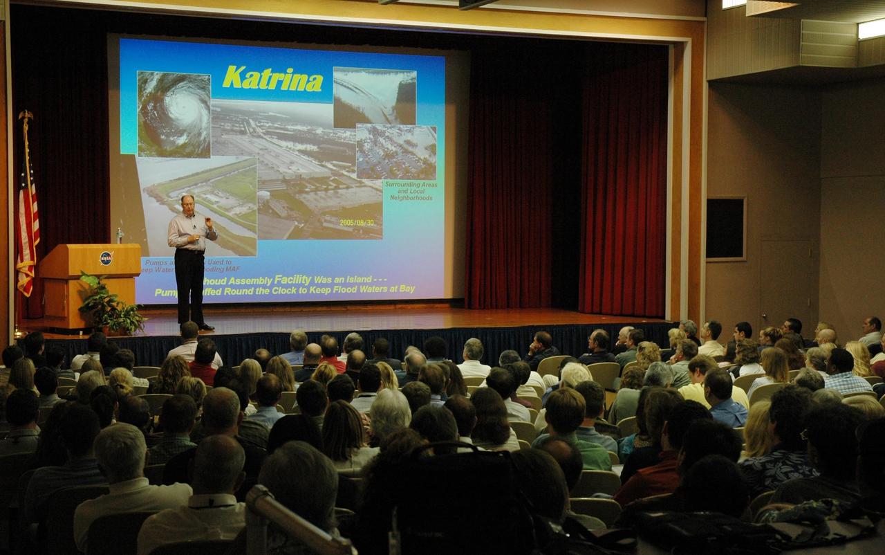 KENNEDY SPACE CENTER, FLA. - At a space shuttle all hands meeting in the training auditorium at NASA's Kennedy Space Center, Space Shuttle Program Manager Wayne Hale discusses effects of Hurricane Katrina on NASA facilities, the status of the program, successes of the STS-114 mission, and the newly released budget.  Photo credit:  NASA/Jim Grossmann