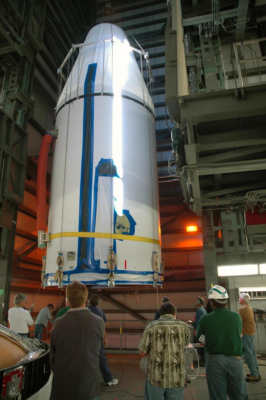 KENNEDY SPACE CENTER, FLA. - On Launch Complex 37 at Cape Canaveral Air Force Station in Florida, the GOES-N satellite is demated and lifted from its Boeing Delta IV rocket.  Launch of the satellite was postponed in August 2005 due to technical issues and postponed to a later date. Due to the extended length of time the spacecraft has been atop the rocket without launching, the weather satellite is being returned to the Astrotech Space Operations payload processing facility for some precautionary retesting and state-of-health checks. GOES-N is the latest in a series of Geostationary Operational Environmental Satellites for NOAA and NASA providing continuous monitoring necessary for intensive data analysis.  Photo credit: NASA/Jack Pfaller