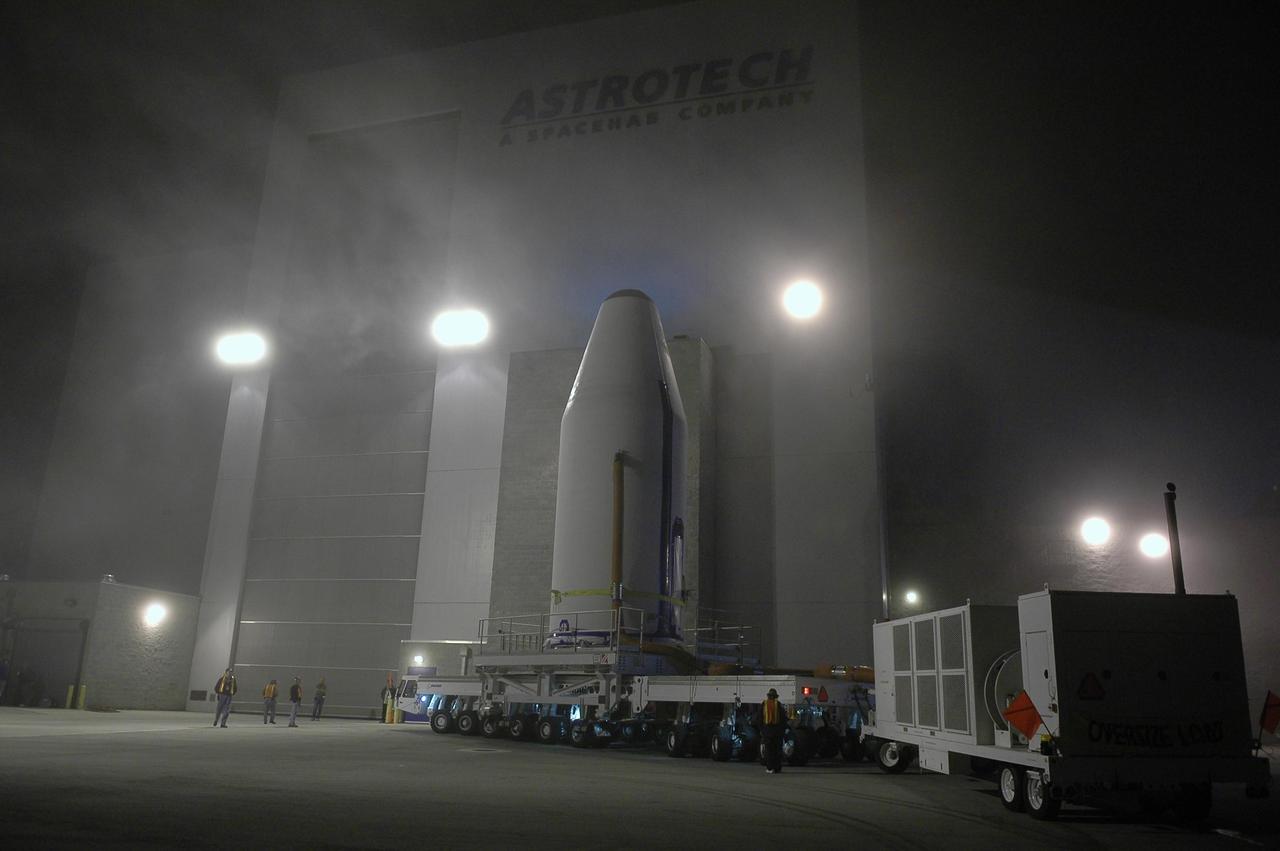 KENNEDY SPACE CENTER, FLA. - The GOES-N satellite, secured inside a payload fairing, arrives at the Astrotech payload processing facility in Titusville, Fla. Liftoff of the satellite from Launch Complex 37 at Cape Canaveral Air Force Station in Florida was scrubbed in August 2005 due to technical issues and postponed to a later date. Due to the extended length of time the spacecraft had been atop its Delta IV rocket without launching, the weather satellite is being returned to Astrotech for some precautionary retesting and state of health checks. GOES-N is the latest in a series of Geostationary Operational Environmental Satellites for NOAA and NASA providing continuous monitoring necessary for intensive data analysis. Photo credit: NASA/Kim Shiflett