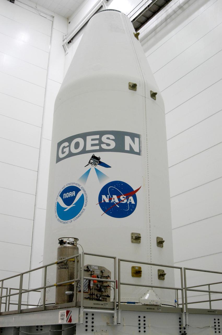 KENNEDY SPACE CENTER, FLA. - At the Astrotech Space Operations payload processing facility in Titusville, Fla., the GOES-N satellite, secured inside a payload fairing, waits inside the clean room high bay for transfer to another room and waiting work stands. Due to the extended length of time the spacecraft had been atop its Boeing Delta IV rocket without launching, the weather satellite has been returned to Astrotech for some precautionary retesting and state of health checks. Liftoff of the satellite from Launch Complex 37 at Cape Canaveral Air Force Station in Florida was scrubbed in August 2005 due to technical issues and postponed to a later date. GOES-N is the latest in a series of Geostationary Operational Environmental Satellites for NOAA and NASA providing continuous monitoring necessary for intensive data analysis. Photo credit: NASA/George Shelton