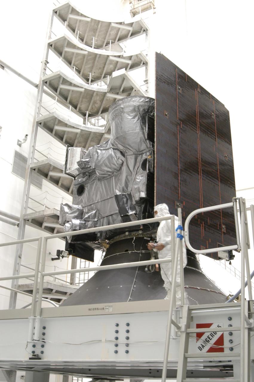 KENNEDY SPACE CENTER, FLA. - Inside a high bay at Astrotech Space Operations in Titusville, Fla., the GOES-N spacecraft is revealed after removal of the fairing to allow testing. GOES-N was demated from its Boeing Delta IV launch vehicle on Launch Complex 37 at Cape Canaveral Air Force Station. The launch was postponed in August 2005 due to technical issues. Due to the extended length of time the spacecraft had been atop the Delta IV without launching, the weather satellite will undergo some precautionary retesting and state of health checks. GOES-N is the latest in a series of Geostationary Operational Environmental Satellites for NOAA and NASA providing continuous monitoring necessary for intensive data analysis. Photo credit: NASA/George Shelton
