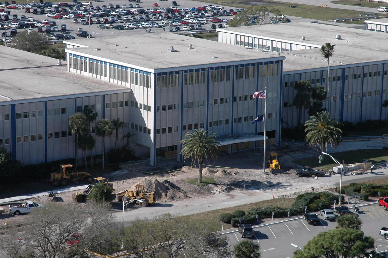 KENNEDY SPACE CENTER, FLA.  - Seen in this aerial view is new construction of the roadway in front of the Headquarters Building at NASA's Kennedy Space Center.  Additional parking will also be provided for visitors to headquarters.  Photo credit: Cory Huston