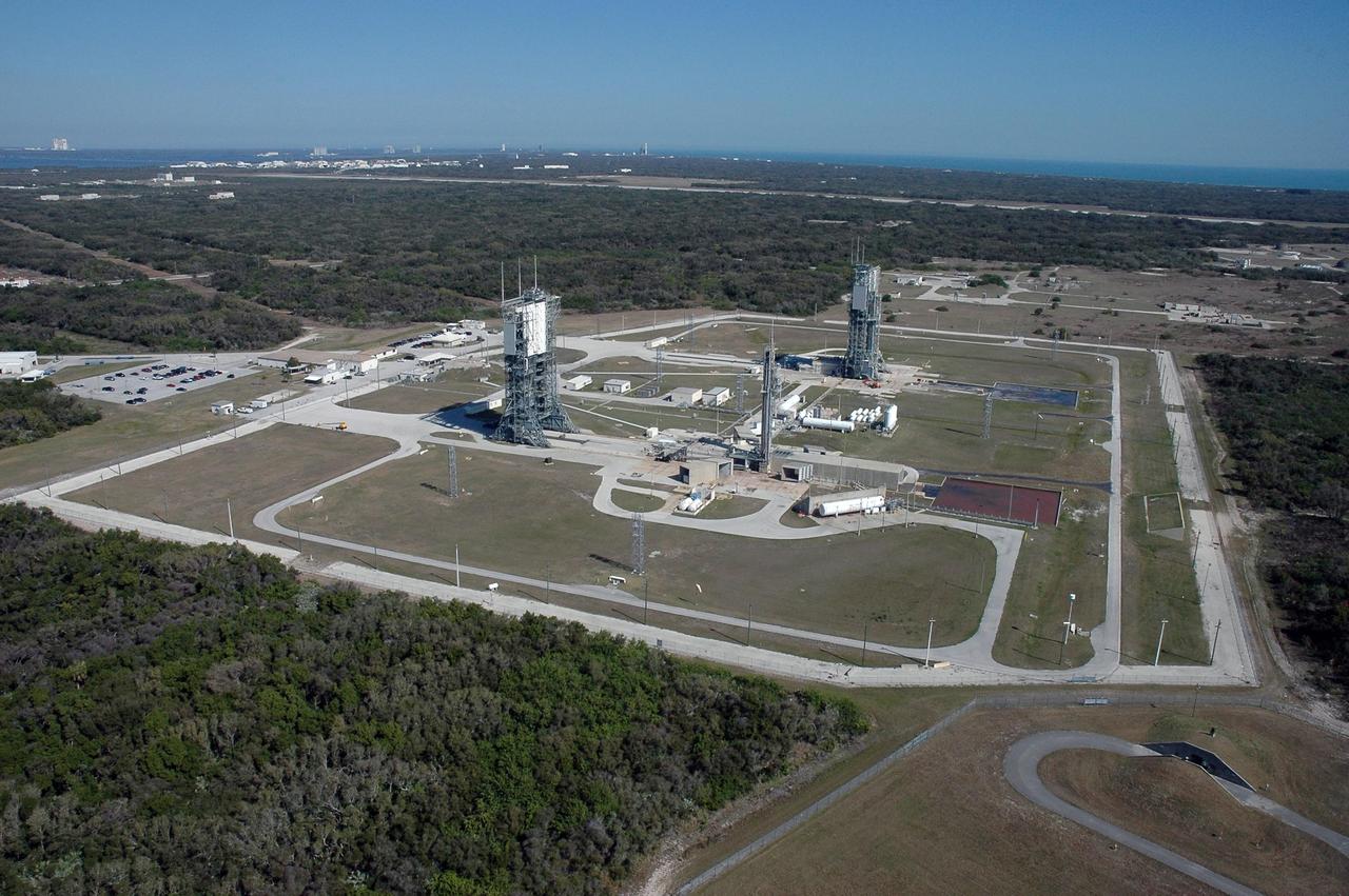 KENNEDY SPACE CENTER, FLA.  - This aerial view shows the Delta launch pads on Cape Canaveral Air Force Station in Florida.  In the upper left background, appearing very small, is NASA Kennedy Space Center's Vehicle Assembly Building.  Photo credit: Cory Huston