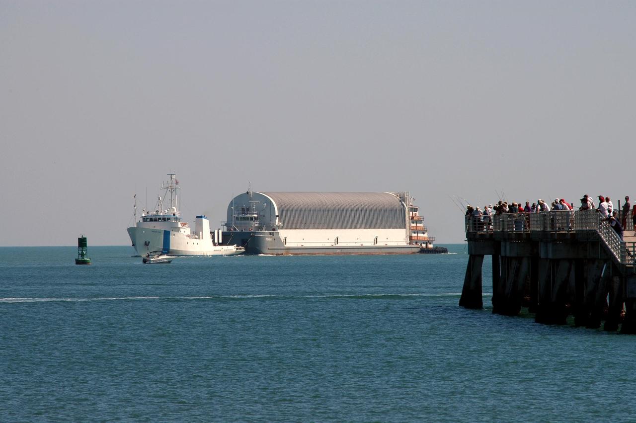 KENNEDY SPACE CENTER, FLA.  - The Freedom Star tows the Pegasus barge to the entrance of Port Canaveral, the last leg of its journey from the Michoud Assembly Facility in New Orleans to Kennedy Space Center.  The barge carries the redesigned external fuel tank that will launch Space Shuttle Discovery on the next shuttle mission, STS-121.  After off-loading, the tank will be moved into the Vehicle Assembly Building and lifted into a checkout cell for further work. The tank, designated ET-119, will fly with many major safety changes, including the removal of the protuberance air load ramps. A large piece of foam from a ramp came off during the last shuttle launch in July 2005. The ramps were removed to eliminate a potential source of damaging debris to the space shuttle.  The next launch of Discovery is scheduled for May 2006.