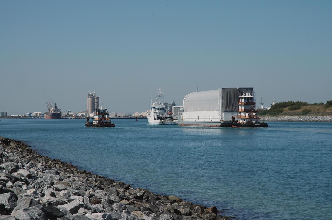 KENNEDY SPACE CENTER, FLA.  - The Freedom Star tows the Pegasus barge through Port Canaveral, the last leg of its journey from the Michoud Assembly Facility in New Orleans to Kennedy Space Center.  The barge carries the redesigned external fuel tank that will launch Space Shuttle Discovery on the next shuttle mission, STS-121.  After off-loading, the tank will be moved into the Vehicle Assembly Building and lifted into a checkout cell for further work. The tank, designated ET-119, will fly with many major safety changes, including the removal of the protuberance air load ramps. A large piece of foam from a ramp came off during the last shuttle launch in July 2005. The ramps were removed to eliminate a potential source of damaging debris to the space shuttle.  The next launch of Discovery is scheduled for May 2006.