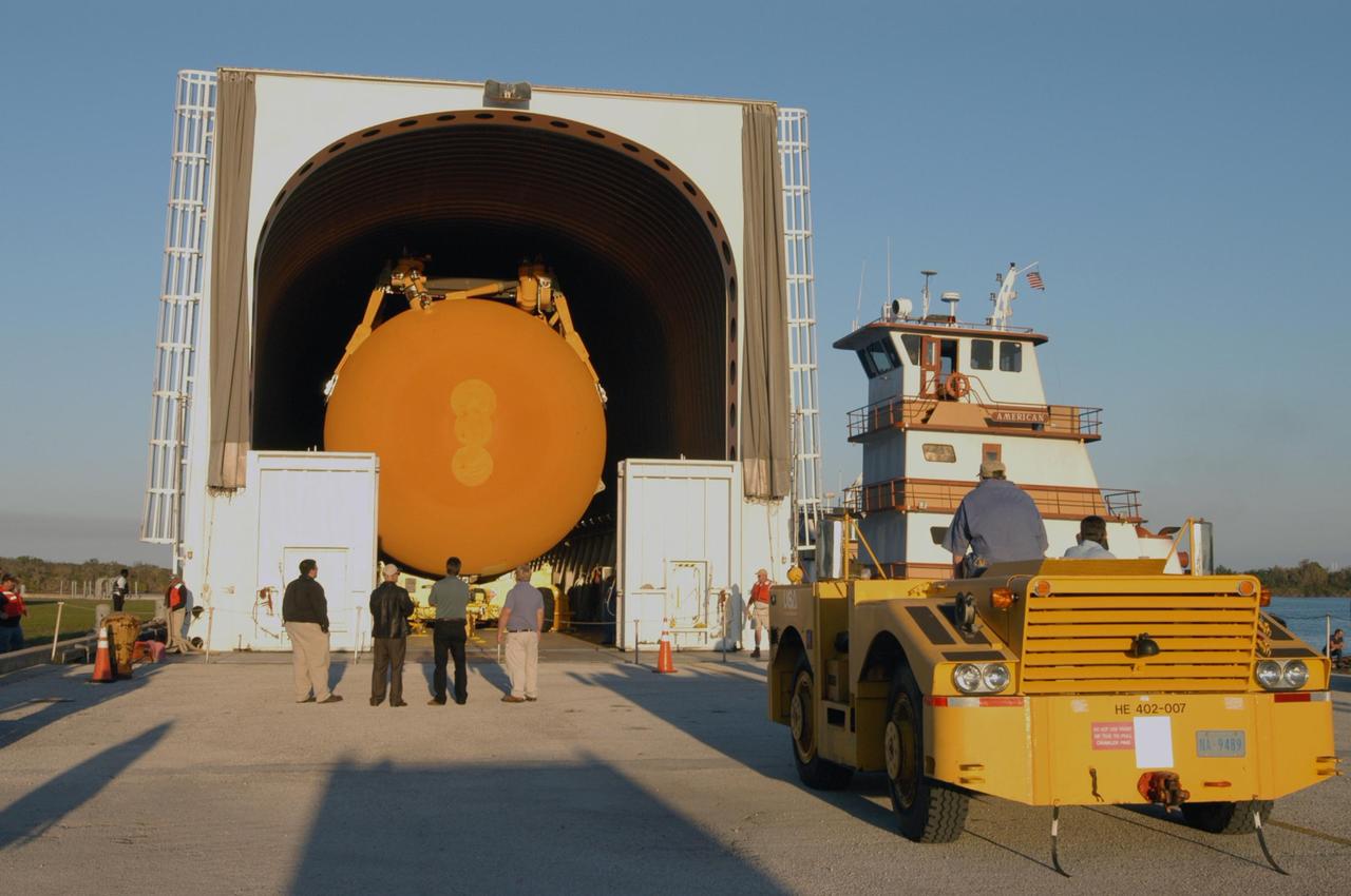 KENNEDY SPACE CENTER, FLA.  - The Pegasus barge is docked in the turn basin close by the Vehicle Assembly Building. The barge delivered the redesigned external fuel tank that will launch Space Shuttle Discovery on the next shuttle mission, STS-121, from the Michoud Assembly Facility in New Orleans to NASA's Kennedy Space Center. After off-loading, the tank will be moved into the Vehicle Assembly Building and lifted into a checkout cell for further work. The tank, designated ET-119, will fly with many major safety changes, including the removal of the protuberance air load ramps. A large piece of foam from a ramp came off during the last shuttle launch in July 2005. The ramps were removed to eliminate a potential source of damaging debris to the space shuttle.  The next launch of Discovery is scheduled for May 2006.