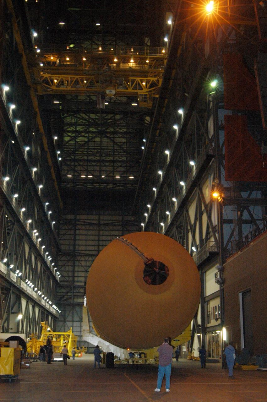 KENNEDY SPACE CENTER, FLA.  - The redesigned external fuel tank that will launch Space Shuttle Discovery on the next shuttle mission, STS-121, arrives safely in the transfer aisle of the Vehicle Assembly Building. The Pegasus barge delivered the tank from the Michoud Assembly Facility in New Orleans to NASA's Kennedy Space Center. Next, the tank will be lifted into a checkout cell for further work. The tank, designated ET-119, will fly with many major safety changes, including the removal of the protuberance air load ramps. A large piece of foam from a ramp came off during the last shuttle launch in July 2005. The ramps were removed to eliminate a potential source of damaging debris to the space shuttle.  The next launch of Discovery is scheduled for May 2006.