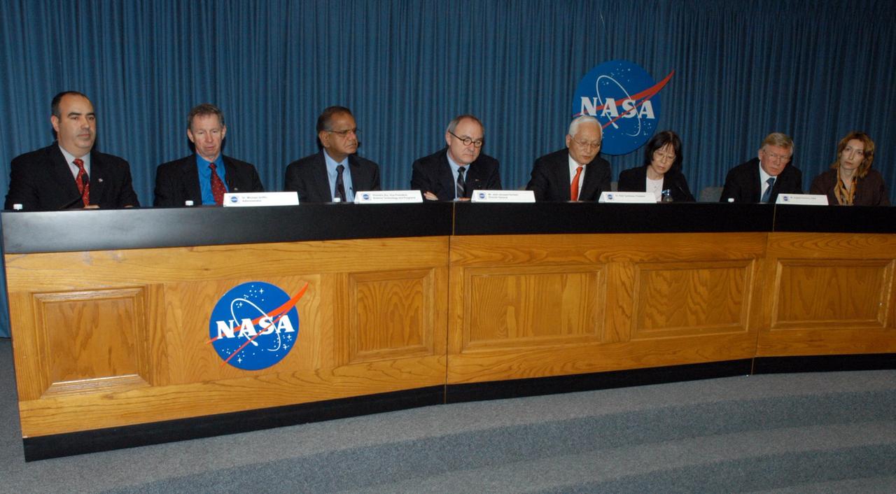 KENNEDY SPACE CENTER, FLA.  - Leaders from space agencies around the world participate in a news briefing following the International Space Station Heads of Agency meeting held at Kennedy Space Center.  From left are NASA Press Secretary Dean Acosta;  NASA Administrator Michael Griffin; Canadian Space Agency Vice-President Space Science, Technology and Programs Virendra Jha; European Space Agency Director-General Jean-Jacques Dordain; Japan Aerospace Exploration Agency President Keiji Tachikawa; Japanese interpreter Masako Kaharia; Russian Federal Space Agency Head Anatolii Perminov; and Russian interpreter Elena Maroko.  The purpose of the meeting was to review International Space Station cooperation and endorse a revision to the station configuration and assembly sequence.  At the meeting, the partners reaffirmed their agencies' commitment to meet their mutual obligations, to implement six person crew operations in 2009 and an adequate number of shuttle flights to complete the assembly of the space station by the end of the decade. Photo credit: NASA/George Shelton