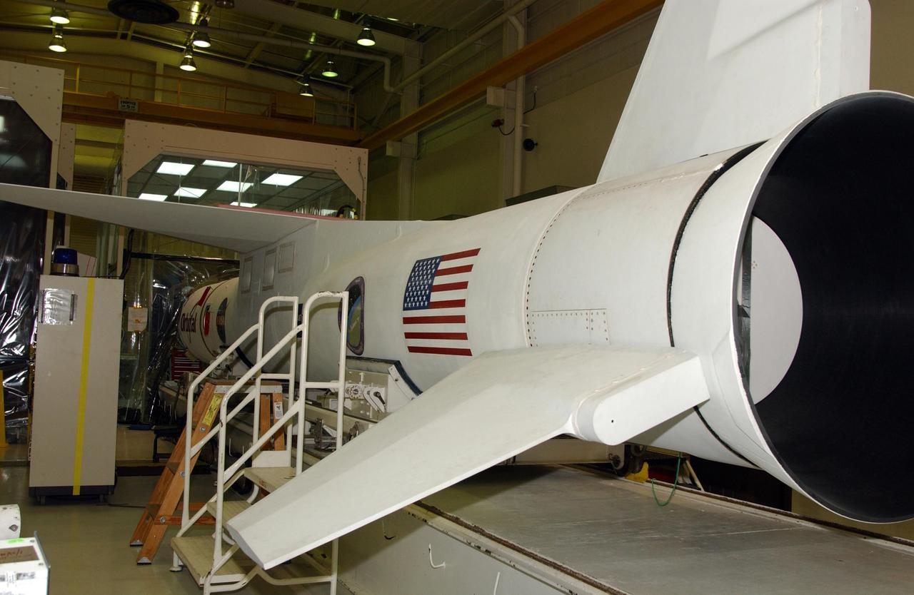 VANDENBERG AIR FORCE BASE, CALIF. -Inside Orbital Sciences’ Building 1555 at Vandenberg Air Force Base in California is the Pegasus XL launch vehicle and the Space Technology 5 (ST5) spacecraft being prepared for encapsulation before launch.  The ST5, mated to Orbital Sciences' Pegasus XL launch vehicle, contains three microsatellites with miniaturized redundant components and technologies.  Each will validate New Millennium Program selected technologies, such as the Cold Gas Micro-Thruster and X-Band Transponder Communication System.  After deployment from the Pegasus, the micro-satellites will be positioned in a “string of pearls” constellation that demonstrates the ability to position them to perform simultaneous multi-point measurements of the magnetic field using highly sensitive magnetometers.  The data will help scientists understand and map the intensity and direction of the Earth’s magnetic field, its relation to space weather events, and affects on our planet.  With such missions, NASA hopes to improve scientists’ ability to accurately forecast space weather and minimize its harmful effects on space- and ground-based systems.  Launch of ST5 is scheduled from the belly of an L-1011 carrier aircraft no earlier than March 14 from Vandenberg Air Force Base.