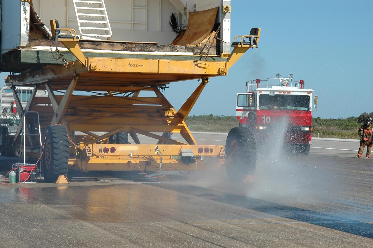 KENNEDY SPACE CENTER, FLA.  -  Equipment is in place at NASA Kennedy Space Center's Shuttle Landing Facility for a simulated emergency rescue of a shuttle crew after landing.  At center is the orbiter mockup. Known as a Mode VI exercise, the operation uses volunteer workers from the Center to pose as astronauts. The purpose of the simulation is to exercise emergency preparedness personnel, equipment and facilities in rescuing astronauts from a downed orbiter and providing immediate medical attention. Photo credit: NASA/Kim Shiflett
