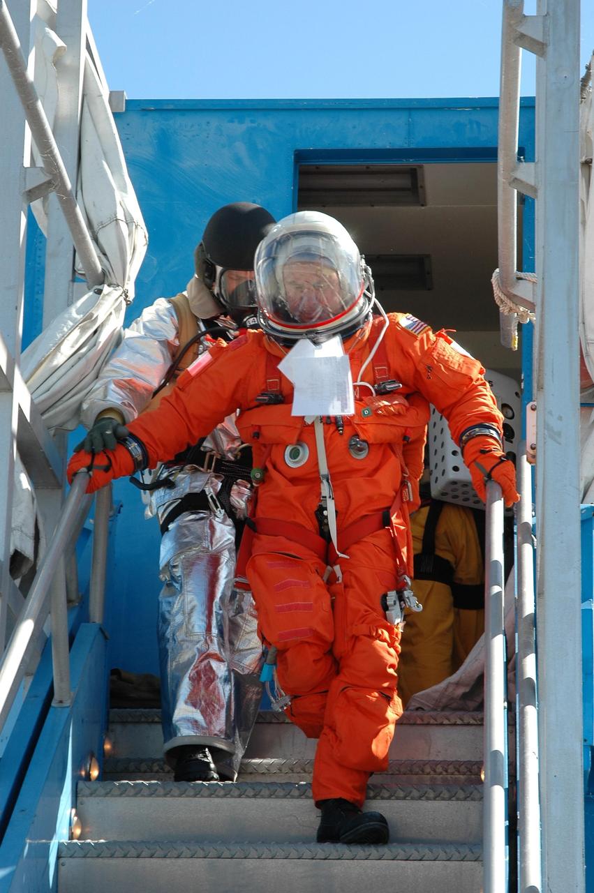 KENNEDY SPACE CENTER, FLA.  -  At NASA Kennedy Space Center's Shuttle Landing Facility, emergency rescue personnel begin the simulated emergency rescue of a shuttle crew after landing.  Known as a Mode VI exercise, the operation uses volunteer workers from the Center to pose as astronauts. The purpose of the simulation is to exercise emergency preparedness personnel, equipment and facilities in rescuing astronauts from a downed orbiter and providing immediate medical attention. Photo credit: NASA/Kim Shiflett