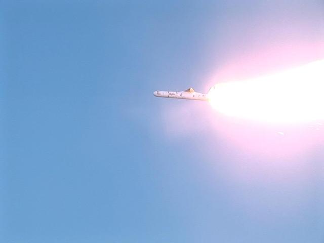 VANDENBERG AIR FORCE BASE, CALIF.  -  Orbital Sciences' Pegasus launch vehicle rockets away from the L-1011 jet aircraft after being released.  Pegasus carries the Space Technology 5 spacecraft with its trio of micro-satellites that will be launched in a "string of pearls" sequence on a near-Earth polar elliptical orbit that will take them from approximately 190 miles (300 kilometers) to 2,800 miles (4,500 kilometers) from the planet. The three spacecraft will conduct science validation using measurements of the Earth's magnetic field collected by the miniature boom-mounted magnetometers on each.