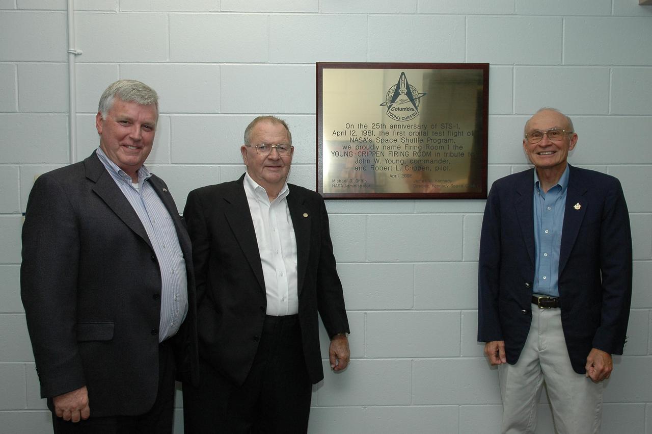 KENNEDY SPACE CENTER, FLA. - In tribute to the 25th anniversary of the first space shuttle flight, NASA's Kennedy Space Center has honored the crew of STS-1, Commander John Young and Pilot Robert Crippen, by dedicating the firing room that launched the historic flight as the "Young · Crippen Firing Room." Making the dedication were (from left) Center Director Jim Kennedy; the NASA test director for STS-1, Norm Carlson; and the project flight engineer for Space Shuttle Columbia, Bob Sieck. On the wall behind them is the plaque marking the dedication. Photo credit: NASA/Kim Shiflett