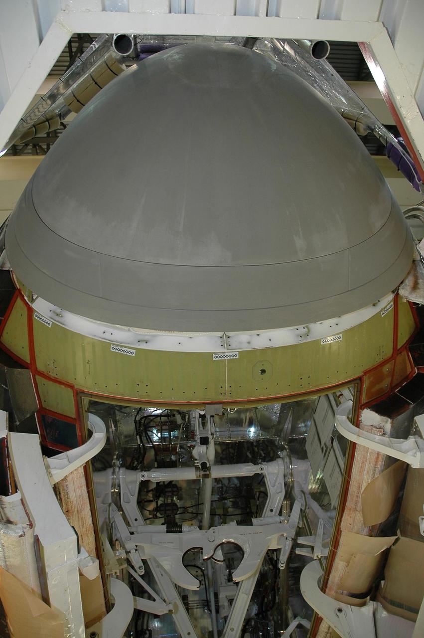 KENNEDY SPACE CENTER, FLA. -   The reinforced carbon-carbon nose cap has been installed on Endeavour in Orbiter Processing Facility bay 2 at NASA's Kennedy Space Center. The nose cap has been insulated with thermal protection system blankets made of a woven ceramic fabric.  The special blankets help insulate the vehicle's nose cap and protect it from the extreme temperatures it will face during a mission. Photo credit: NASA/Jim Grossmann