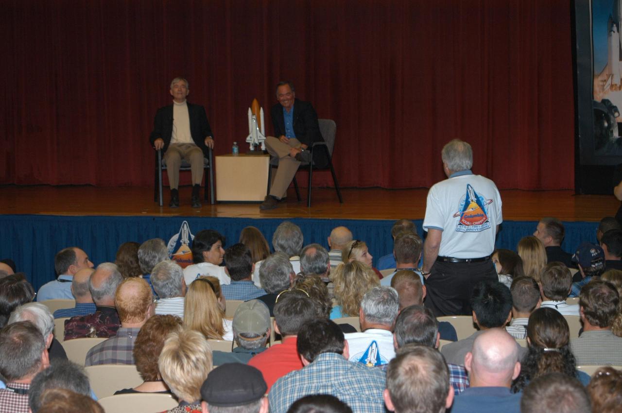 KENNEDY SPACE CENTER, FLA. - To honor the 25th anniversary of the first shuttle launch on April 12, 1981, STS-1 Commander John Young (left) and Pilot Bob Crippen (right) were invited to share their experiences with employees during a special presentation at Kennedy. Here, Young relates his feelings about making that historic flight. Photo credit: NASA/George Shelton