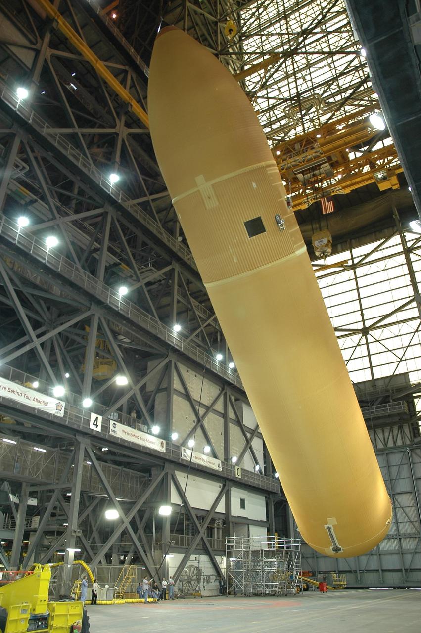 KENNEDY SPACE CENTER, FLA.  -  Inside the Vehicle Assembly Building at NASA's Kennedy Space Center, external tank number 119 is shifted to a horizontal position for placement on a transporter where technicians will reapply the thermal protection system foam that was removed in order to replace the tank's four liquid hydrogen engine cutoff sensors. The tank is being prepared to launch Space Shuttle Discovery on mission STS-121 in July.  Photo credit: NASA/Cory Huston