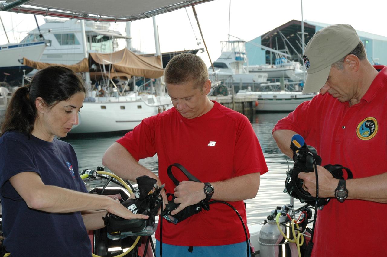 KENNEDY SPACE CENTER, FLA. -- Astronaut Nicole Stott, Dr. Tim Broderick of the University of Cincinnati, and astronaut Dave Williams are preparing for their 17-day mission on the NASA Extreme Environment Mission Operations (NEEMO) project. The mission will take place onboard the National Oceanic and Atmospheric Administration (NOAA) Aquarius Underwater Laboratory situated three miles off Key Largo in the Florida Keys National Marine Sanctuary, anchored 62 feet below the surface. Williams is leading the undersea mission, which also includes astronaut Ron Garan. The astronauts are testing space medicine concepts and moon-walking techniques.