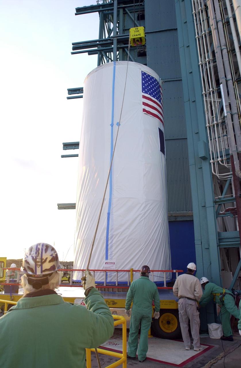 VANDENBERG AIR FORCE BASE, Calif. - On Space Launch Complex 2 at Vandenberg Air Force Base in California, a crane is attached to the dual spacecraft CALIPSO and CloudSat, covered by a transport canister. The spacecraft will be lifted and mated with a Boeing Delta II rocket for launch on April 21. CALIPSO stands for Cloud-Aerosol Lidar and Infrared Pathfinder Satellite Observation. It will fly in combination with the CloudSat satellite to provide never-before-seen 3-D perspectives of how clouds and aerosols form, evolve, and affect weather and climate. CALIPSO and CloudSat will join three other satellites in orbit to enhance understanding of climate systems. Launch of CALIPSO/CloudSat is scheduled for April 21.