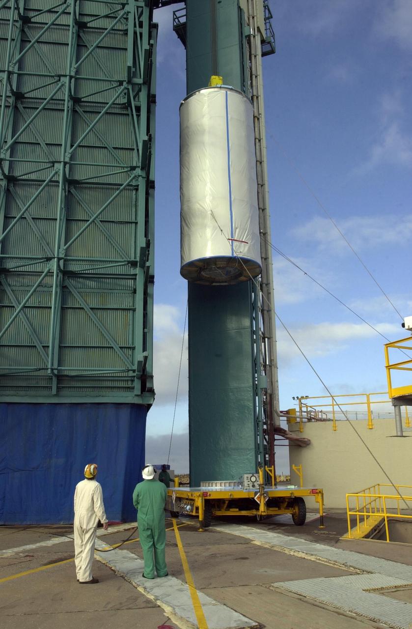 VANDENBERG AIR FORCE BASE, Calif. - On Space Launch Complex 2 at Vandenberg Air Force Base in California, the dual spacecraft CALIPSO and CloudSat, covered by a transport canister, is lifted up into the mobile service tower. There the spacecraft will be mated with a Boeing Delta II rocket for launch on April 21. CALIPSO stands for Cloud-Aerosol Lidar and Infrared Pathfinder Satellite Observation. It will fly in combination with the CloudSat satellite to provide never-before-seen 3-D perspectives of how clouds and aerosols form, evolve, and affect weather and climate. CALIPSO and CloudSat will join three other satellites in orbit to enhance understanding of climate systems. Launch of CALIPSO/CloudSat is scheduled for April 21.