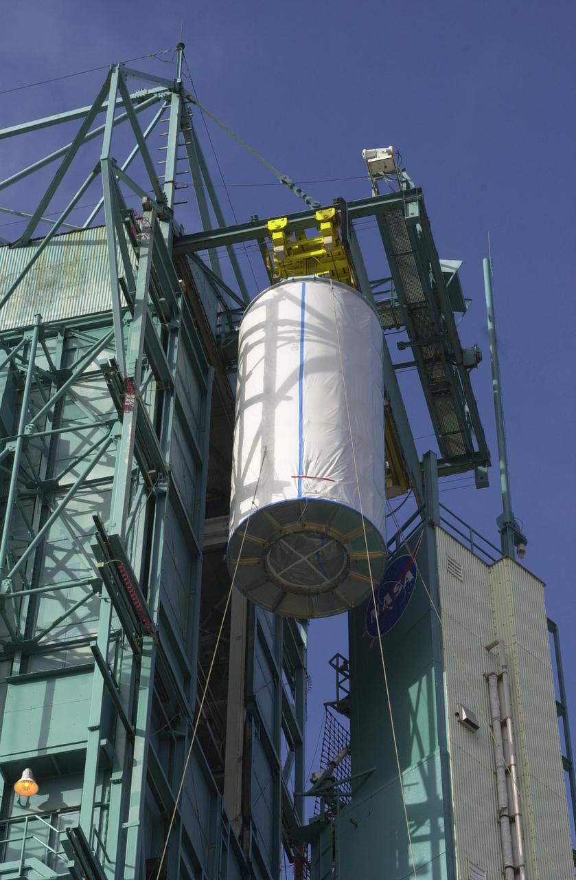 VANDENBERG AIR FORCE BASE, Calif. - On Space Launch Complex 2 at Vandenberg Air Force Base in California, the dual spacecraft CALIPSO and CloudSat, covered by a transport canister, is lifted up into the mobile service tower. There the spacecraft will be mated with a Boeing Delta II rocket for launch on April 21. CALIPSO stands for Cloud-Aerosol Lidar and Infrared Pathfinder Satellite Observation. It will fly in combination with the CloudSat satellite to provide never-before-seen 3-D perspectives of how clouds and aerosols form, evolve, and affect weather and climate. CALIPSO and CloudSat will join three other satellites in orbit to enhance understanding of climate systems. Launch of CALIPSO/CloudSat is scheduled for April 21.