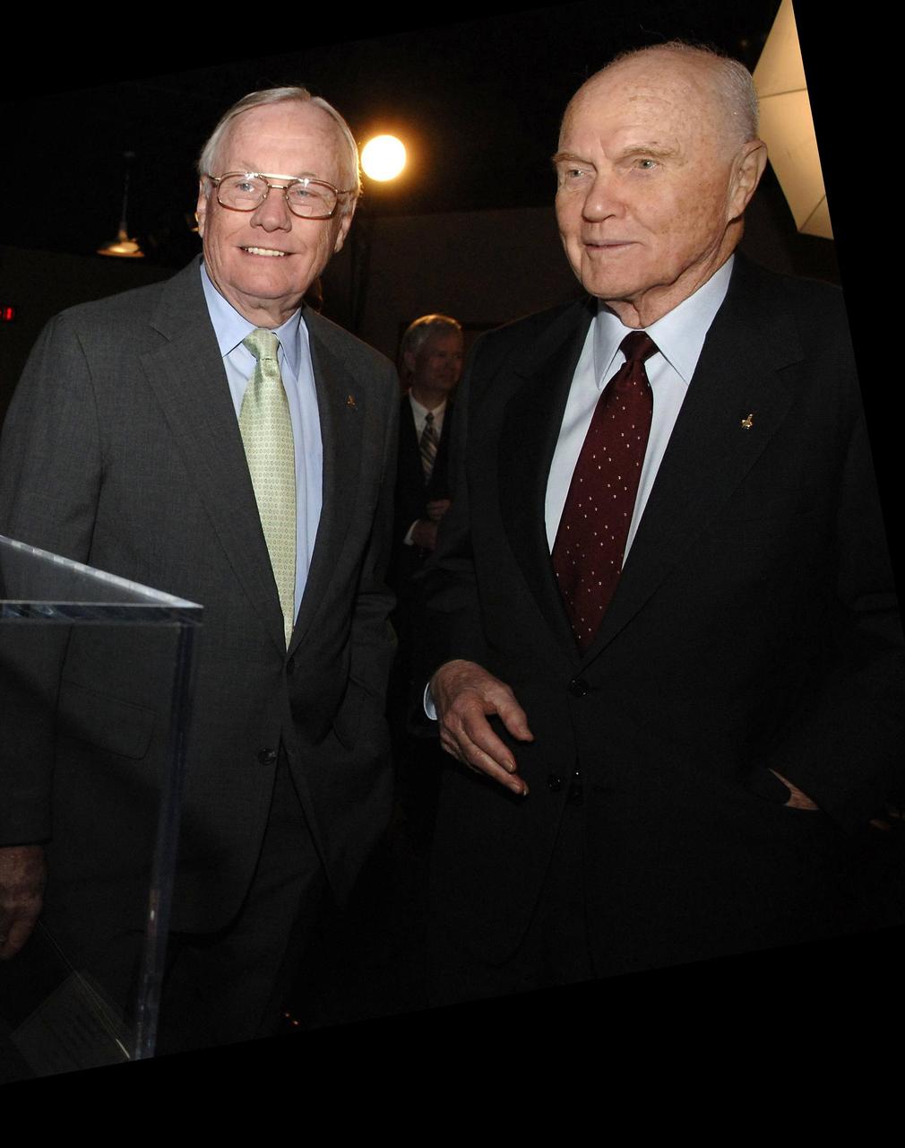 CINCINNATI, OHIO - NASA Administrator Michael Griffin presented the NASA Ambassadors of Exploration award to Neil Armstrong (left).  At right is former awardee John Glenn.  Armstrong received the award that includes a moon rock to recognize the sacrifices and dedication of the astronauts and others who were part of the Mercury, Gemini and Apollo programs.  A former naval aviator, NASA test pilot and Apollo 11 commander, Armstrong was the first human to ever land a spacecraft on the moon and the first to step on the lunar surface.  Armstrong's award will be displayed at the Cincinnati Museum Center at Union Terminal.  Photo credit: NASA/Bill Ingalls