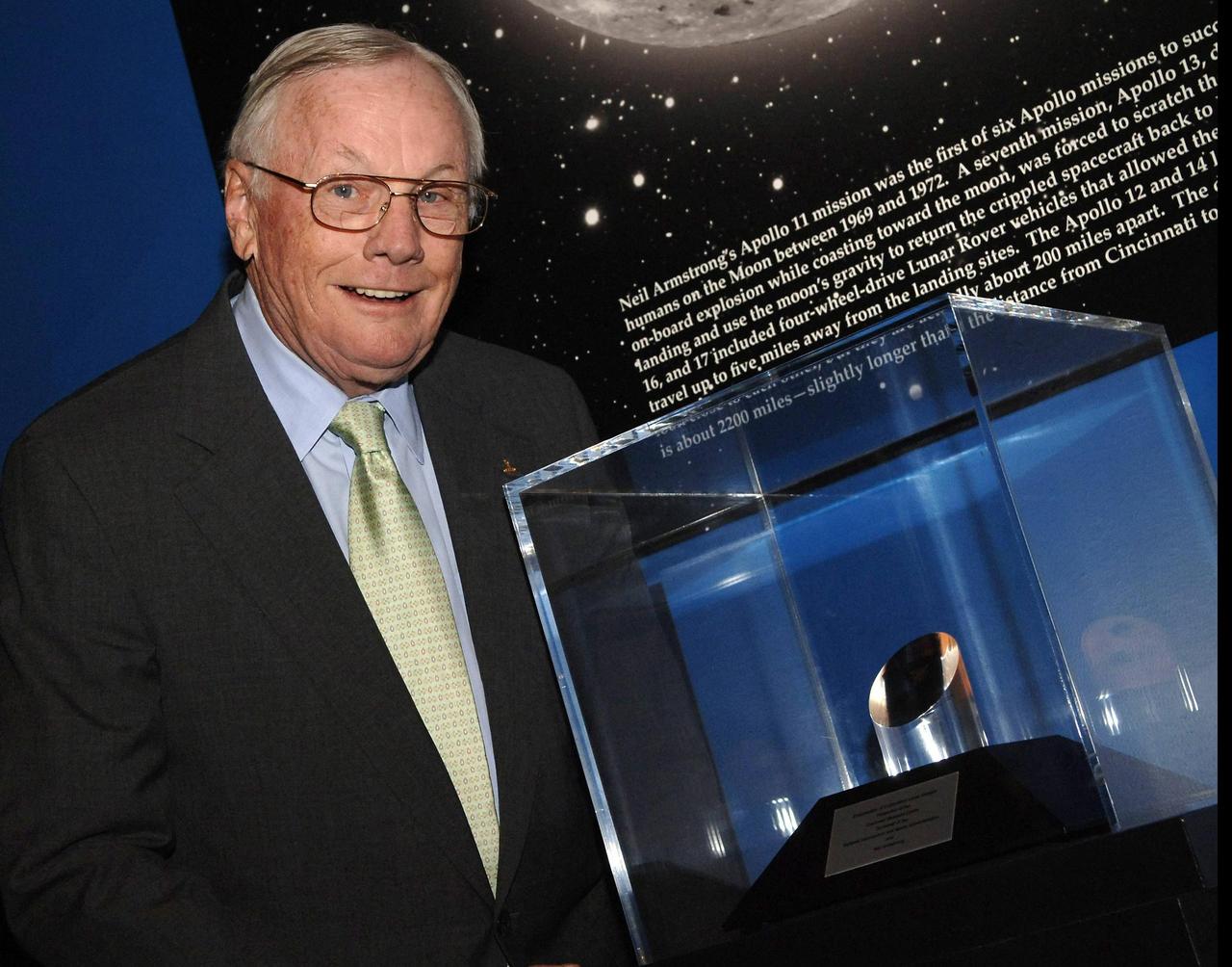 CINCINNATI, OHIO - Former astronaut Neil Armstrong stands next to the NASA Ambassadors of Exploration award presented to him by NASA Administrator Michael Griffin.  Armstrong received the award that includes a moon rock to recognize the sacrifices and dedication of the astronauts and others who were part of the Mercury, Gemini and Apollo programs.  A former naval aviator, NASA test pilot and Apollo 11 commander, Armstrong was the first human to ever land a spacecraft on the moon and the first to step on the lunar surface.  Armstrong's award will be displayed at the Cincinnati Museum Center at Union Terminal.  Photo credit: NASA/Bill Ingalls