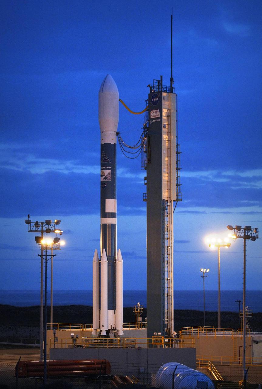 VANDENBERG AIR FORCE BASE, CALIF.  - On Space Launch Complex 2, the Delta II rocket stands ready for fueling in preparation for launch.  The CALIPSO and CloudSat satellites are set to launch at 6:02 a.m. EDT on April 23 from Vandenberg Air Force Base (VAFB) on missions to study clouds and aerosols, tiny particles in the air.  CALIPSO and CloudSat are set to fly into orbit aboard a Boeing Delta II rocket. The Delta II is designed to boost medium-sized satellites and robotic explorers into space.  NASA selected a model 7420-10C for this mission, which is a two-stage rocket equipped with four strap-on motors and a protective 10-foot payload fairing.  Photo credit: NASA/Bill Ingalls
