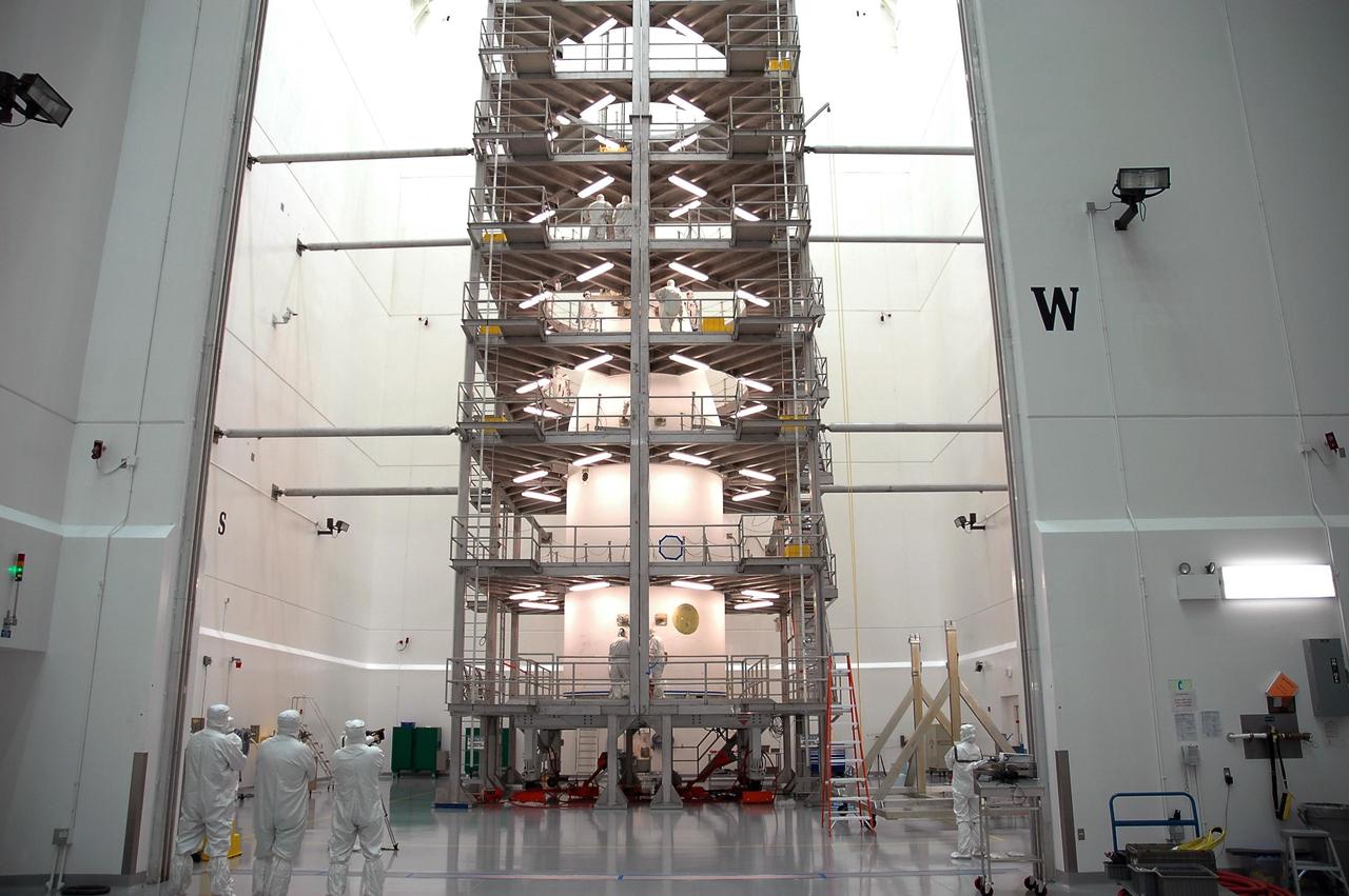 KENNEDY SPACE CENTER, FLA.  -  In the high bay at Astrotech Space Operations in Titusville, Fla., the encapsulated GOES-N satellite is surrounded by work platforms.  GOES-N is the latest in a series of Geostationary Operational Environmental Satellites for NOAA and NASA providing continuous monitoring necessary for intensive data analysis. GOES-N will be launched May 18 on a Boeing Delta IV rocket from Cape Canaveral Air Force Station in Florida. Photo credit: NASA/Jack Pfaller