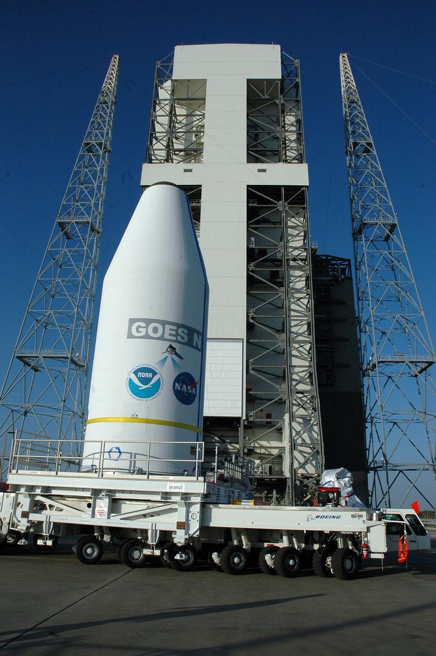 KENNEDY SPACE CENTER, FLA.  -   The encapsulated spacecraft GOES-N arrives aboard a transporter on Launch Complex 37 at Cape Canaveral Air Force Station in Florida.  The spacecraft will be lifted up into the mobile service tower and mated with a Boeing Delta IV rocket for launch.  GOES-N is the latest in a series of Geostationary Operational Environmental Satellites for NOAA and NASA providing continuous monitoring necessary for intensive data analysis. GOES-N is scheduled for launch May 18.  Photo credit: NASA/Jack Pfaller