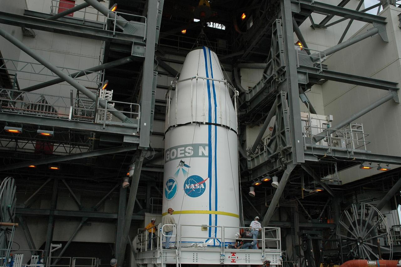 KENNEDY SPACE CENTER, FLA. - On Launch Complex 37 at Cape Canaveral Air Force Station in Florida, the GOES-N spacecraft is ready to be lifted into the mobile service tower. There it will be mated with the second stage of the Boeing Delta IV rocket. GOES-N is the latest in a series of Geostationary Operational Environmental Satellites for NOAA and NASA, providing continuous monitoring necessary for intensive data analysis. GOES-N is scheduled to be launched May 18 in an hour-long window between 6:14 and 7:14 p.m. EDT. Photo credit: NASA/Charisse Nahser